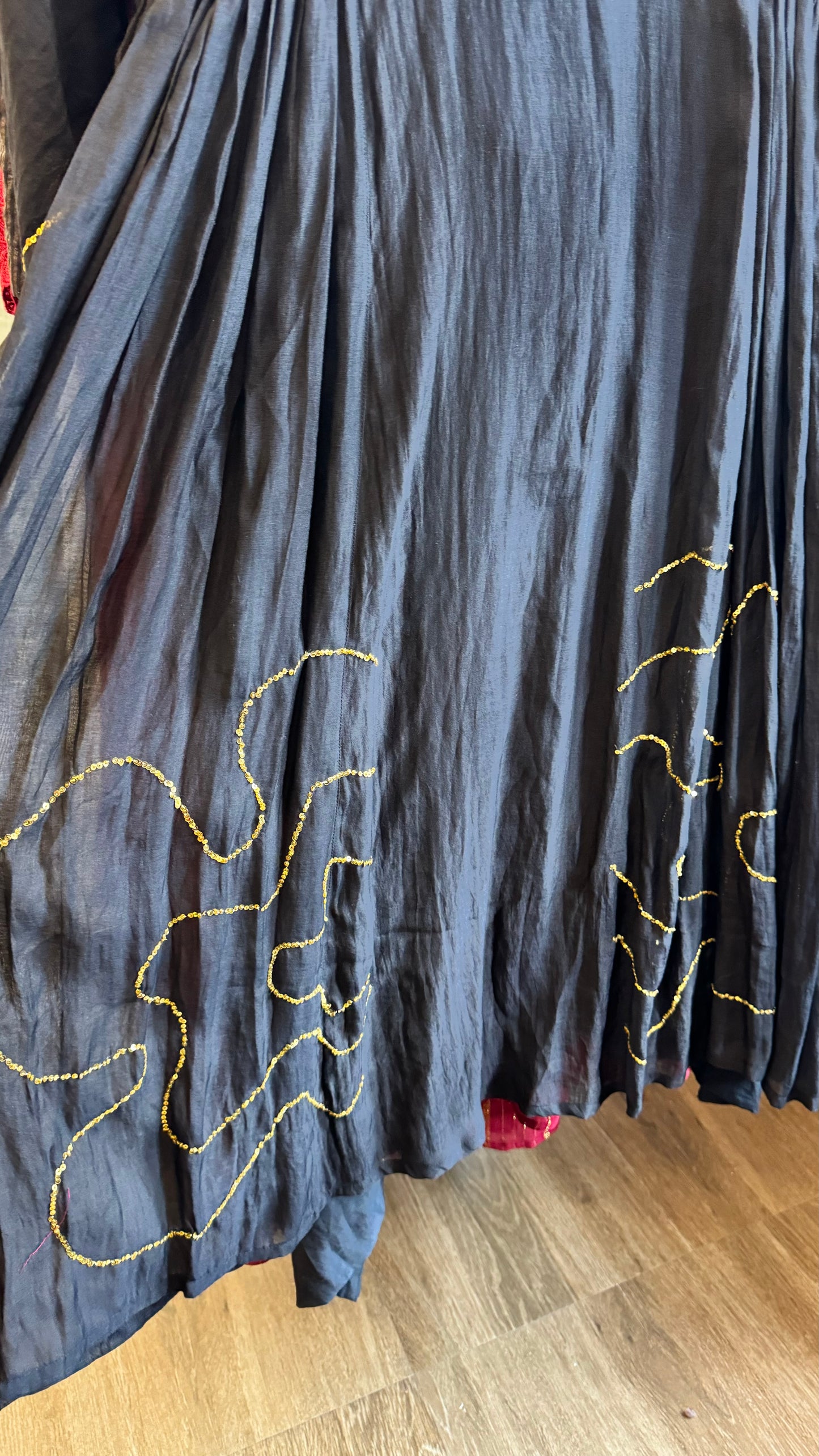 Black hand woven mul chanderi panel dress with golden sequins work on flares and sleeves with slip & bottom