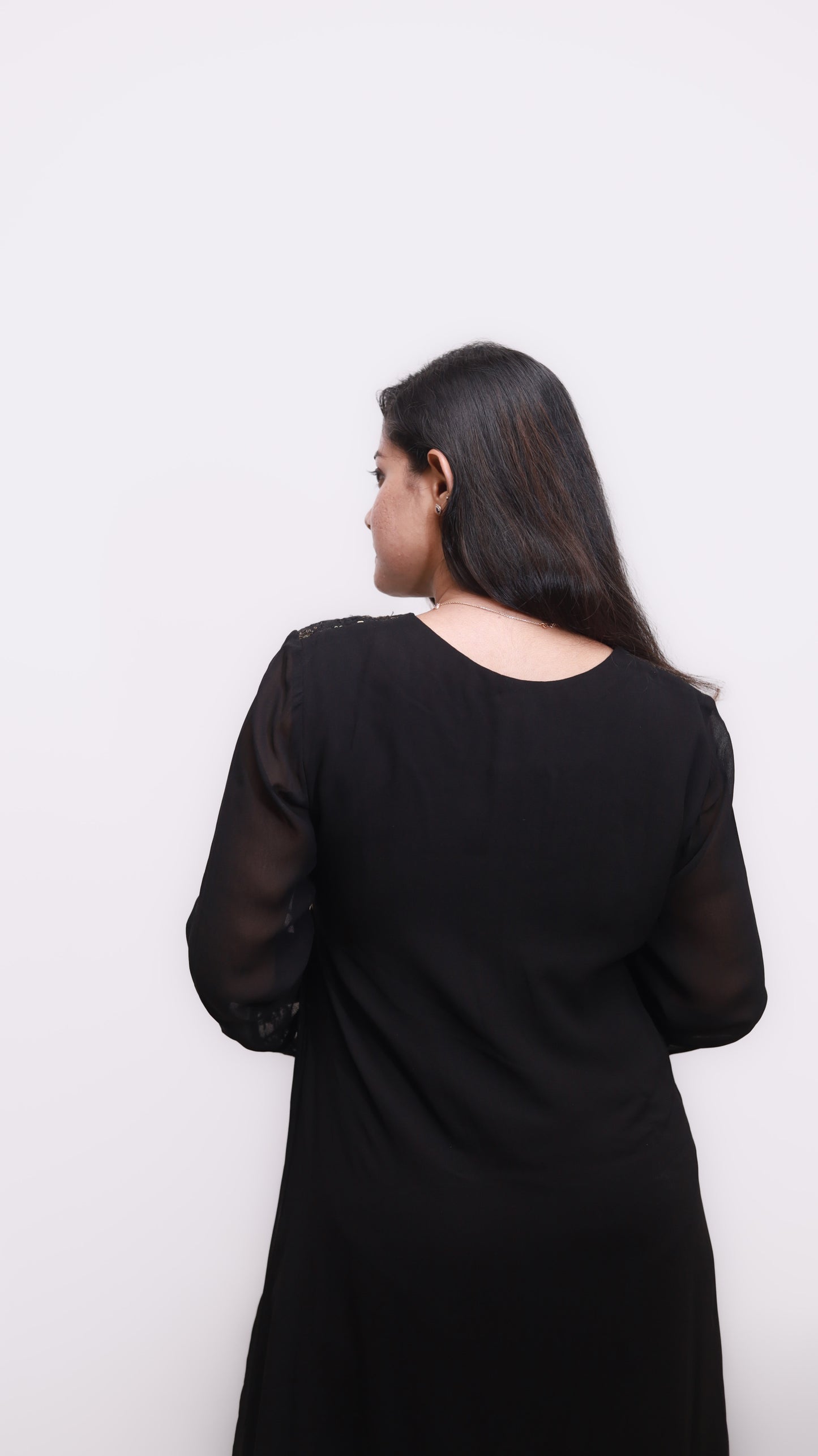 Elegant Black Dress with Embellished Neckline