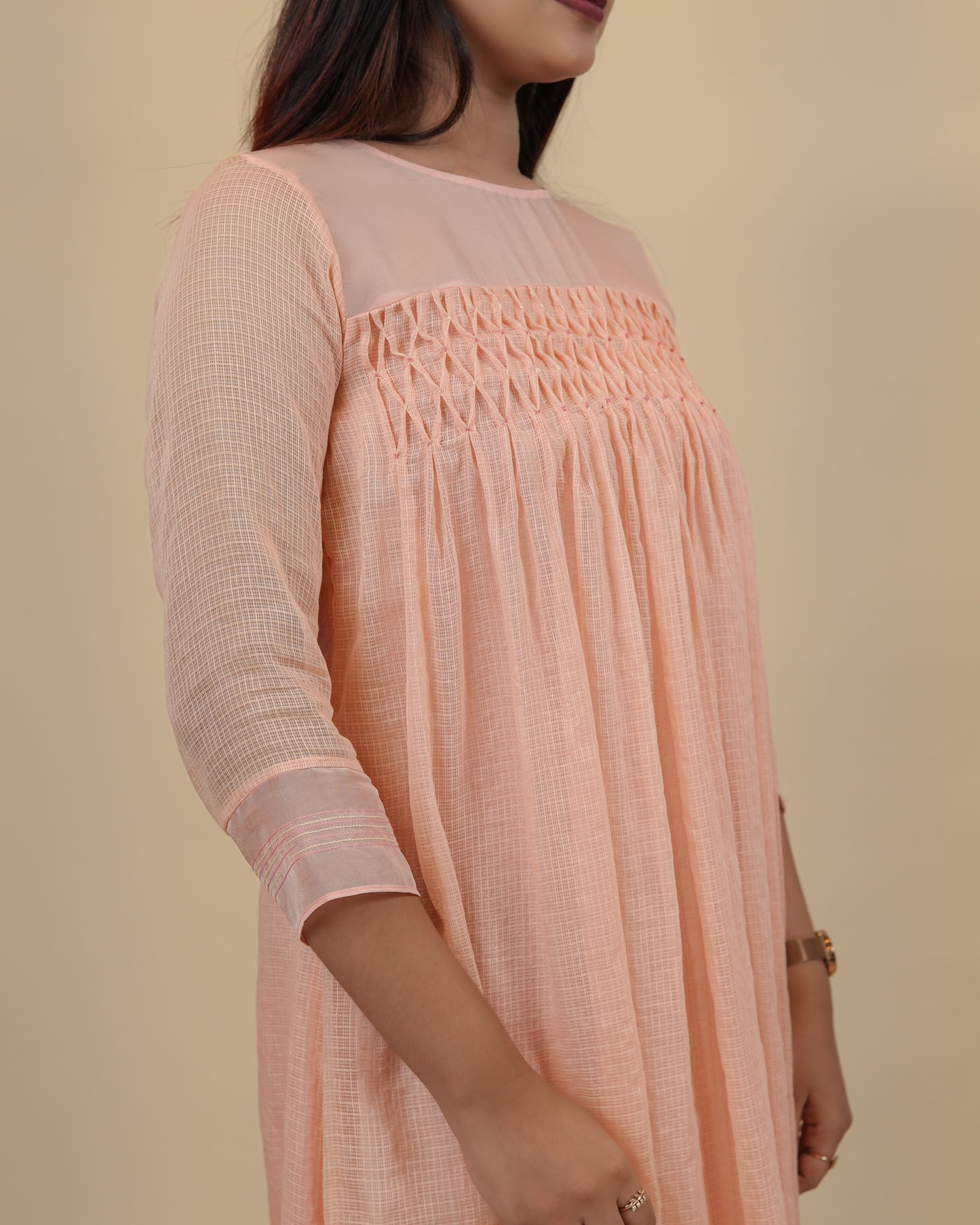 Elegant Peach dress with smocking yoke