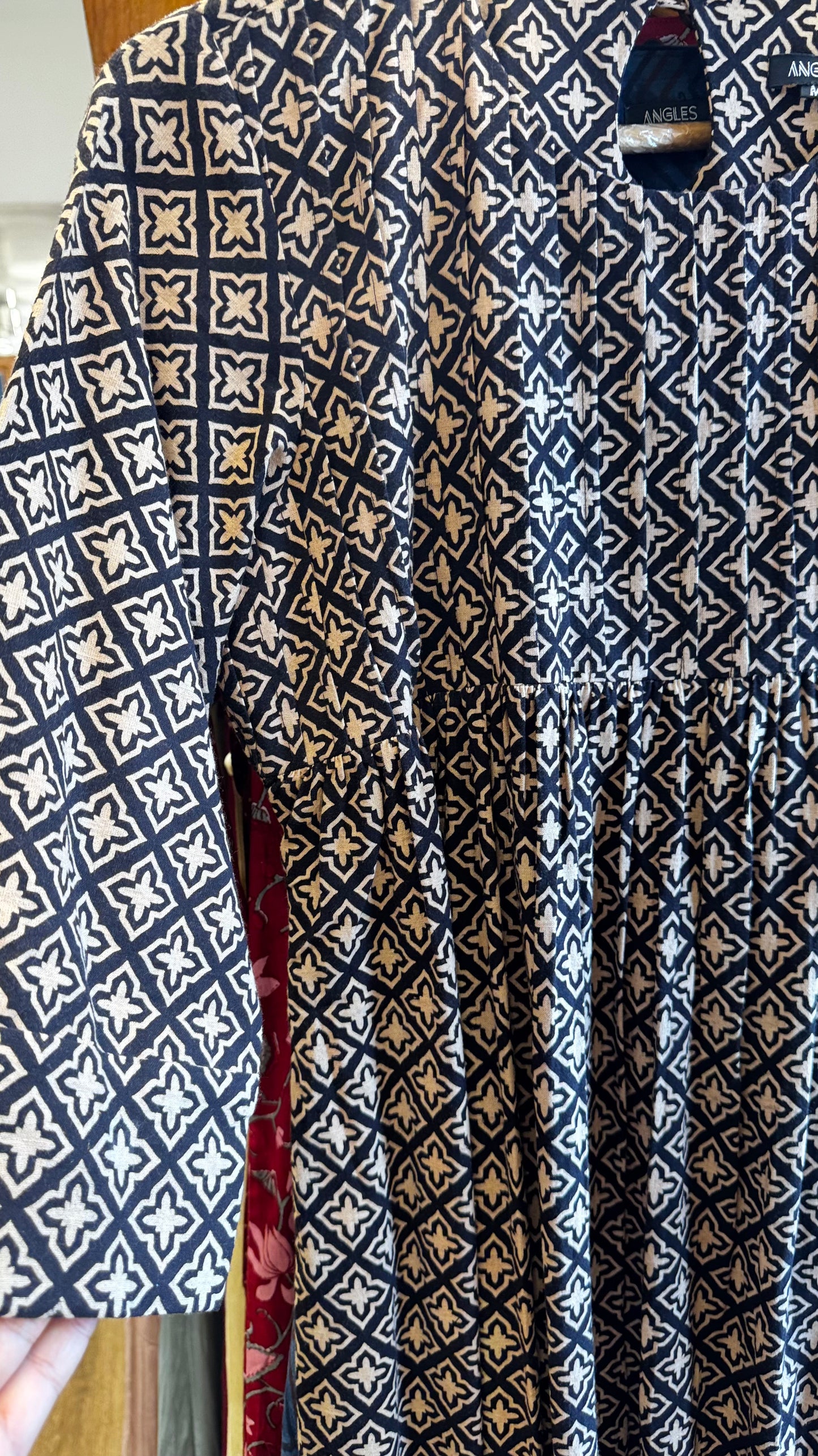 black and cream pattern dress with pleats on yoke size L