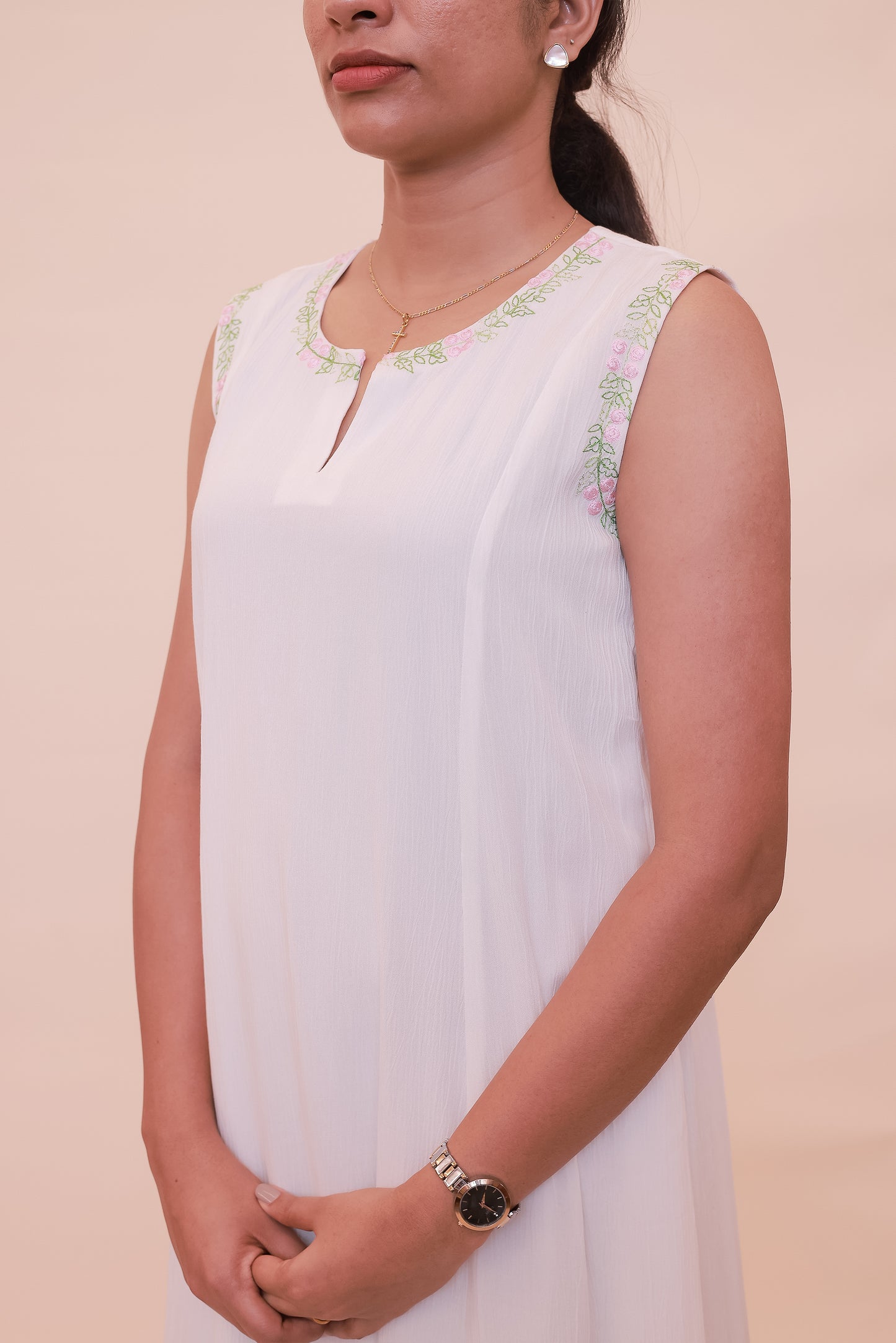White sleeveless with embroidery on neck