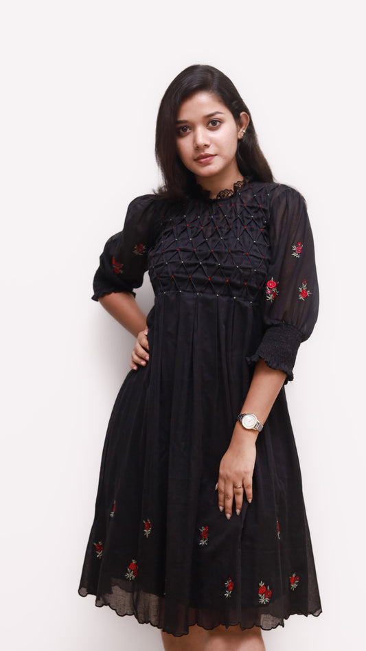 Black dress with smocking on yoke, floral embroidery