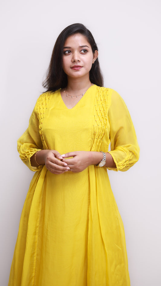 Yellow dress with smocking on sides