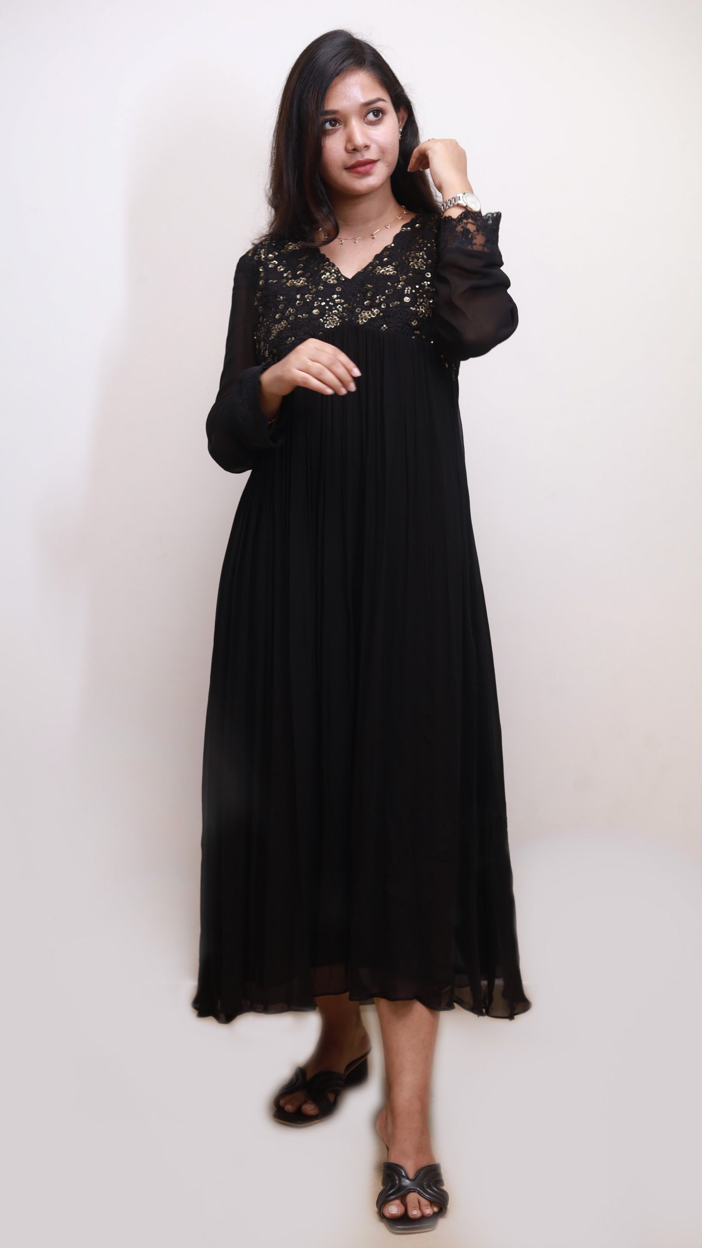 Black with floral embroidery and sequence in gold on yoke