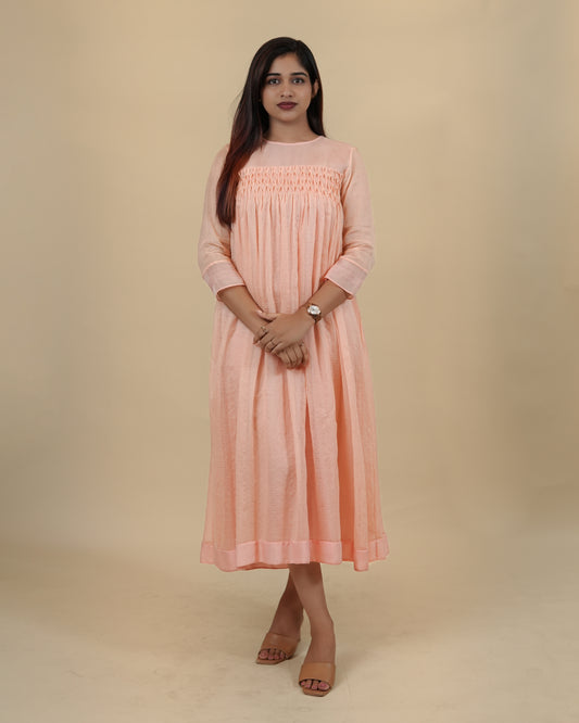 Elegant Peach dress with smocking yoke