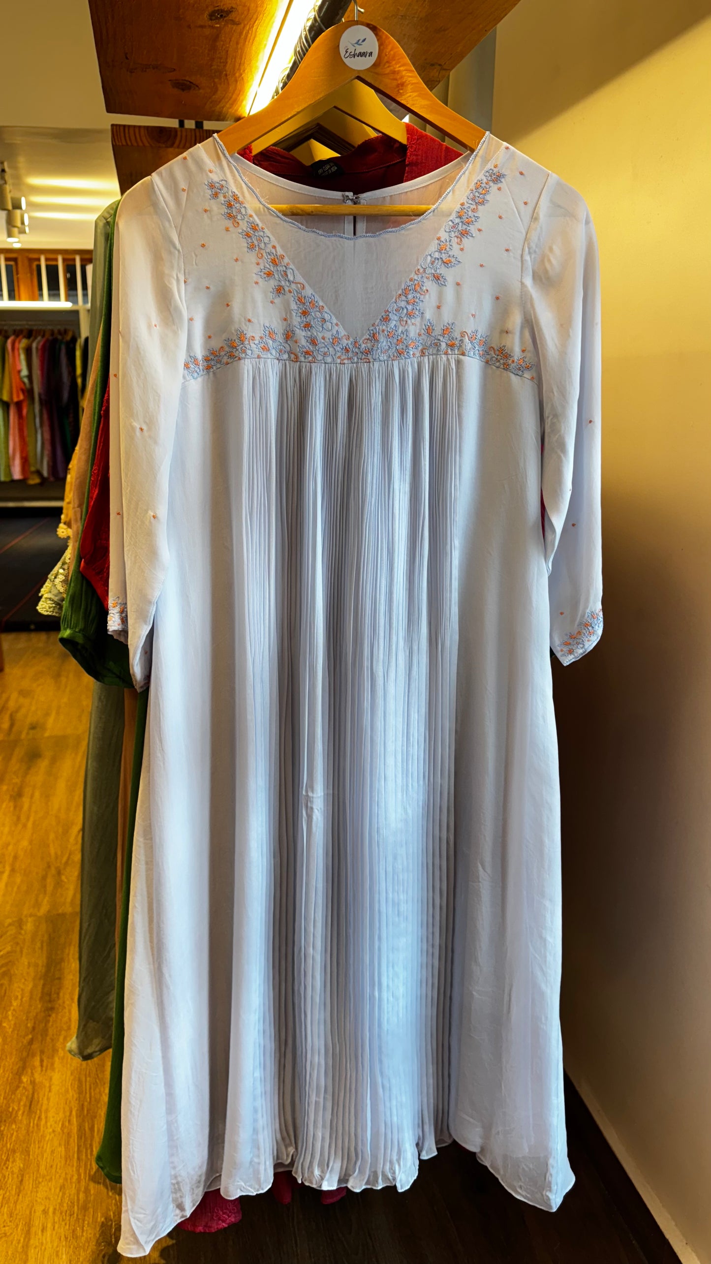 Light blue colour embroidered yoke with a V-neckline and pleated front size L
