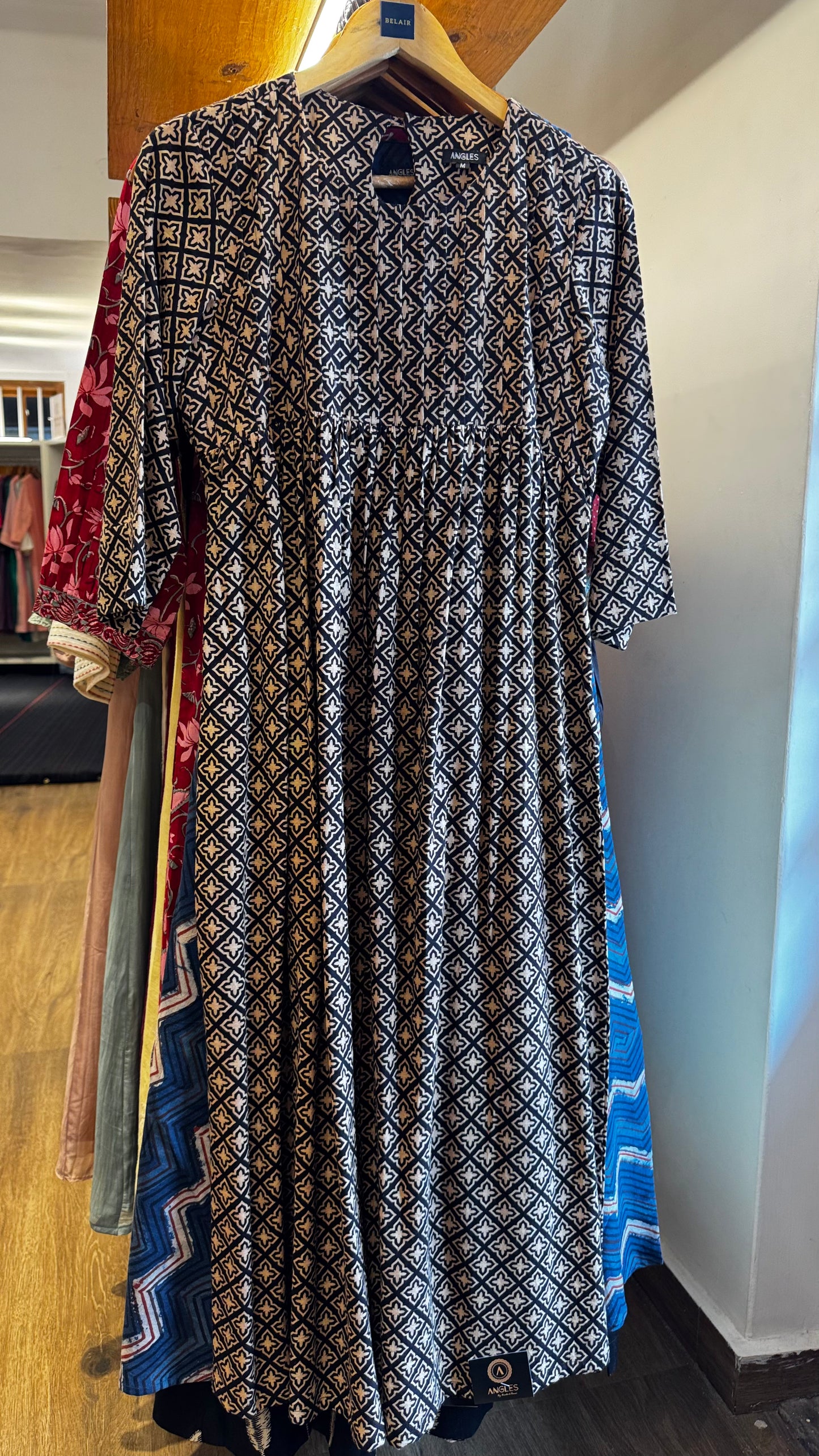 black and cream pattern dress with pleats on yoke size L