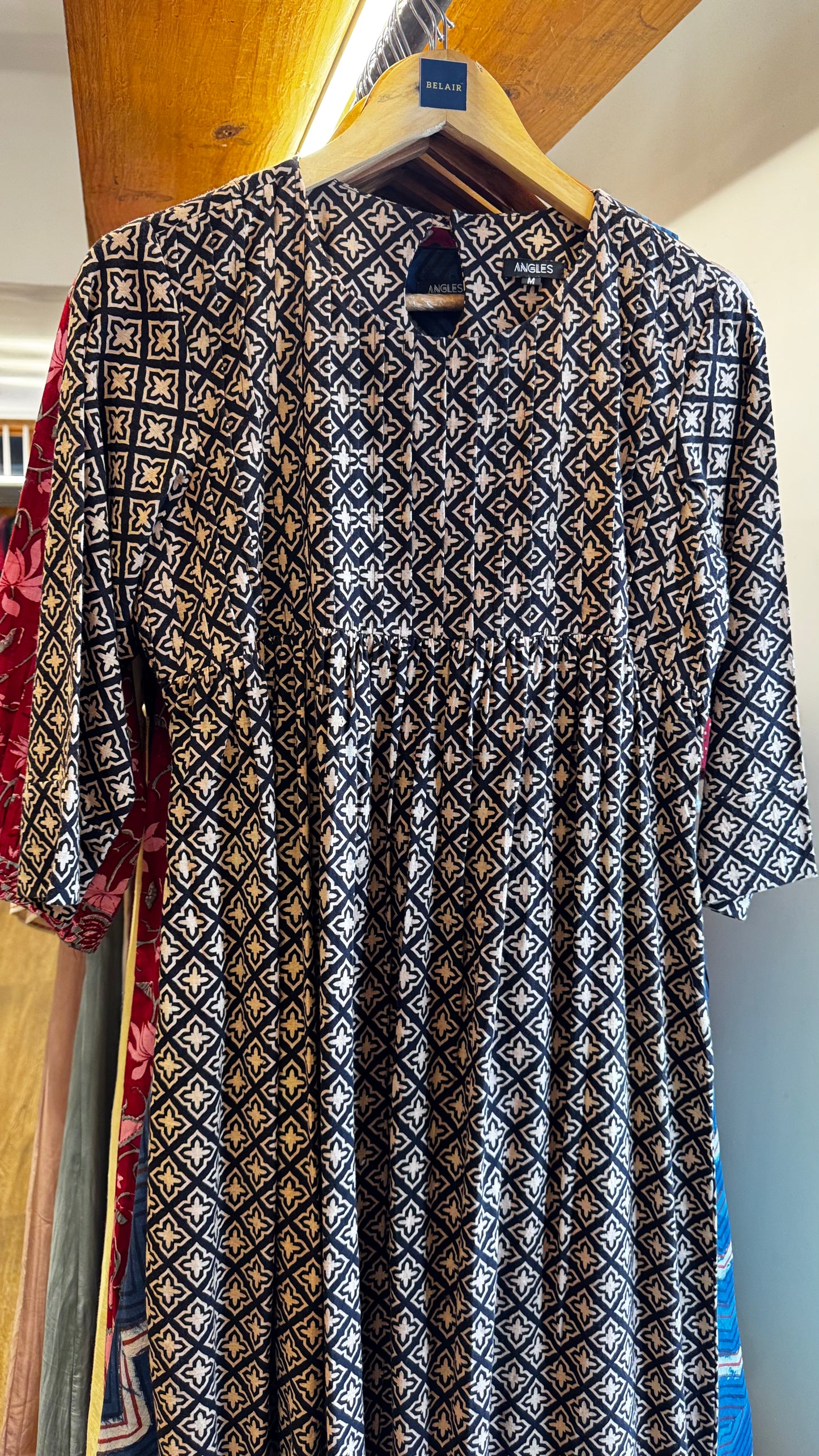 black and cream pattern dress with pleats on yoke size L